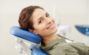 woman in dentist chair smiling